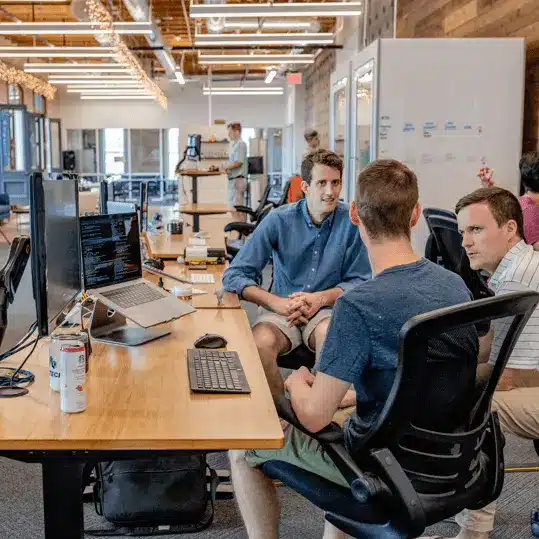 USA Payments merchant services team collaborating in a modern open office